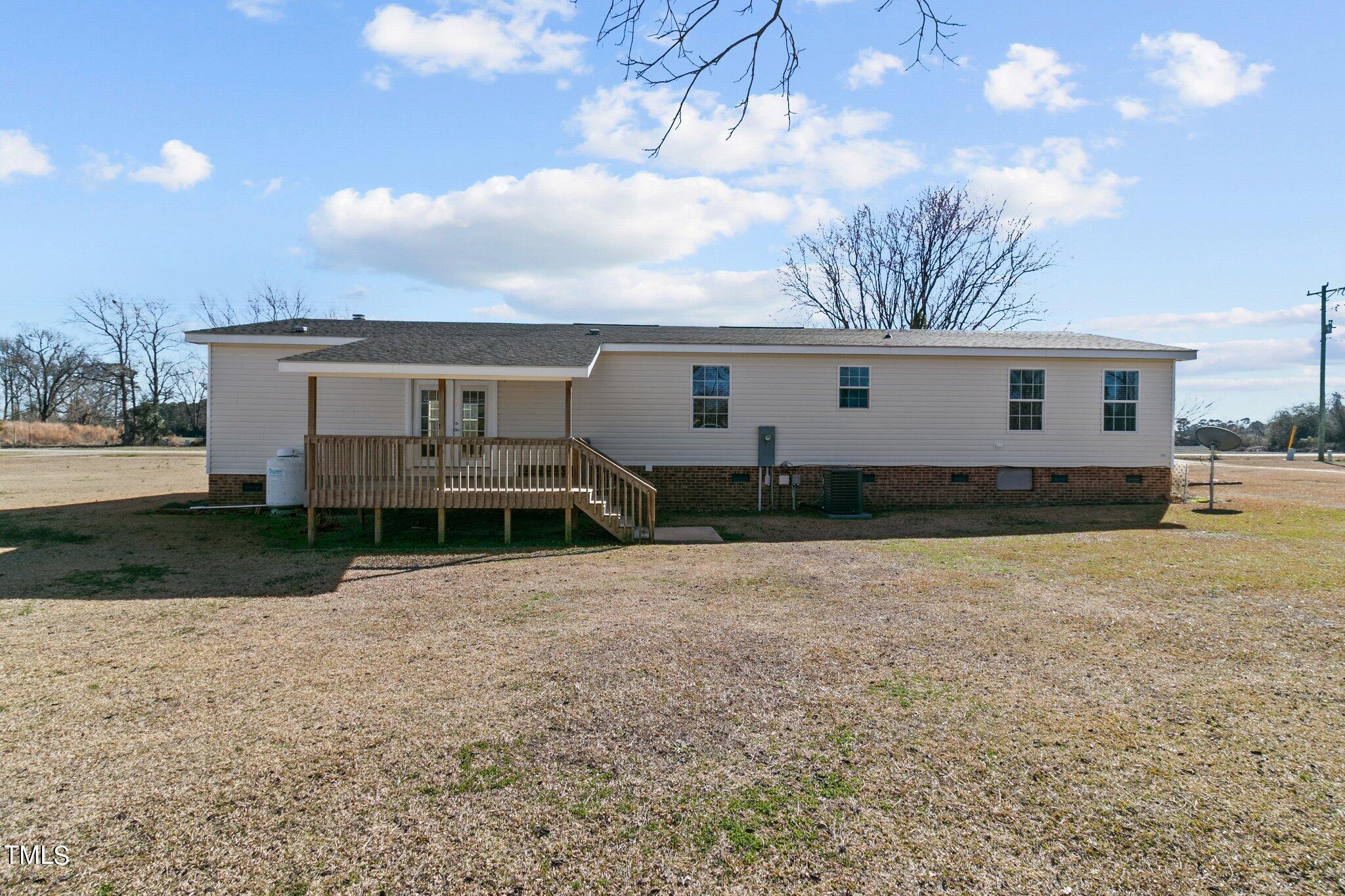 7929 Keener Road Clinton, NC 28328 - Photo 33 of 36 a view of a house with backyard and sitting area