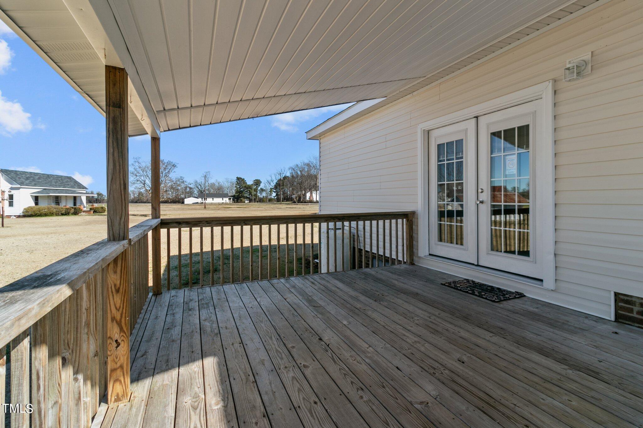 7929 Keener Road Clinton, NC 28328 - Photo 4 of 36 a balcony with wooden floor