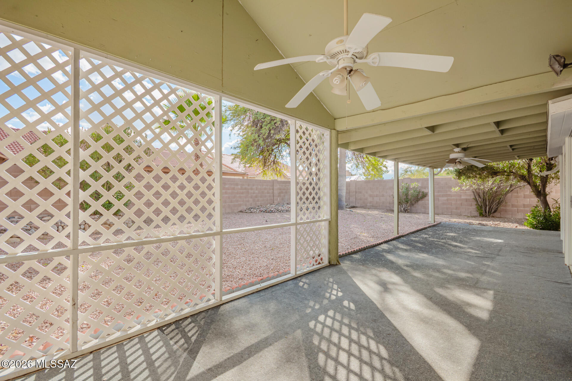 5331 West Eaglestone Loop Tucson, AZ 85742 - Photo 32 of 35 a view of a livingroom with a ceiling fan and window