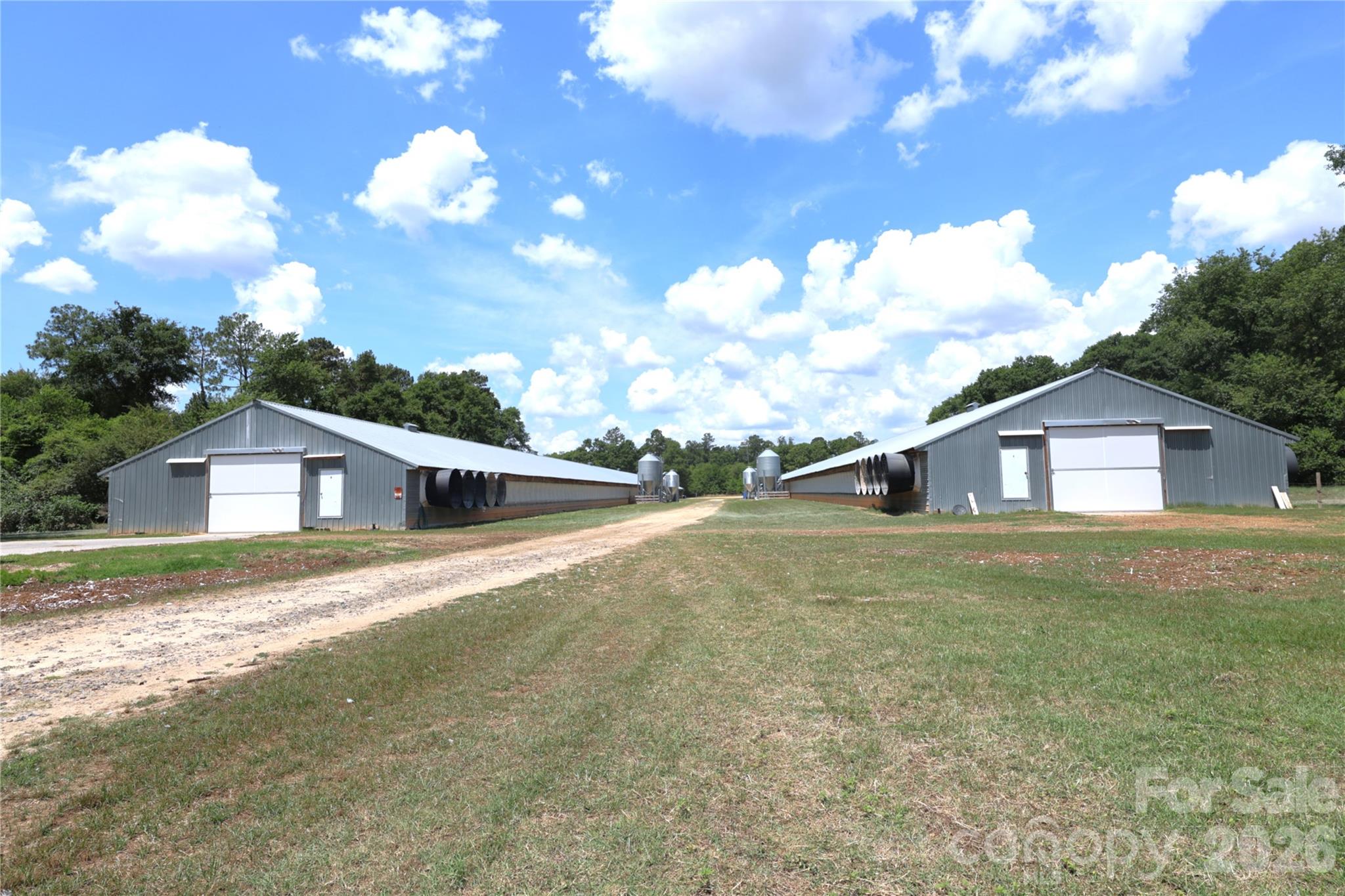 a view of a house with a big yard next to a house