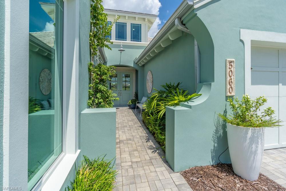 5060 Martinique Drive Naples, FL 34113 - Photo 40 of 49 Entering the delightful walkway to the front entrance