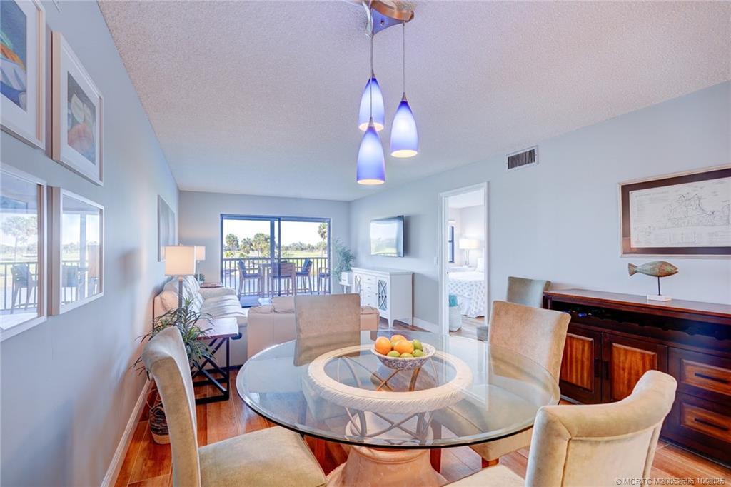 40 Northeast Plantation Road, Unit 203 Jensen Beach, FL 34957 - Photo 21 of 53 a dining room with furniture and window