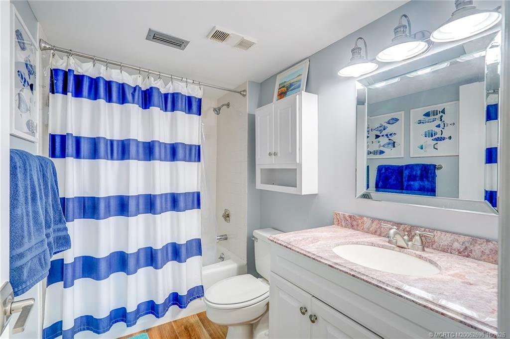 40 Northeast Plantation Road, Unit 203 Jensen Beach, FL 34957 - Photo 32 of 53 a bathroom with a sink toilet and shower