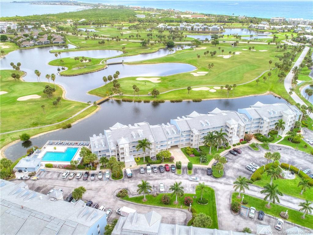 40 Northeast Plantation Road, Unit 203 Jensen Beach, FL 34957 - Photo 43 of 53 an aerial view of residential houses with outdoor space