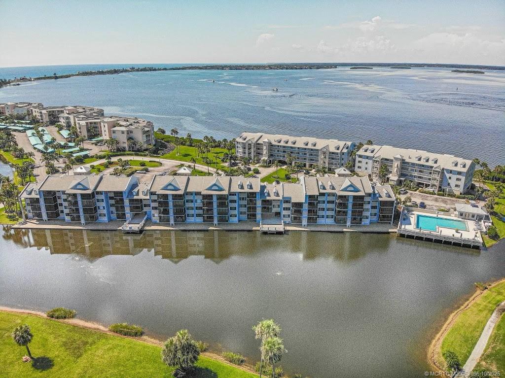 40 Northeast Plantation Road, Unit 203 Jensen Beach, FL 34957 - Photo 45 of 53 a view of a swimming pool with a lake view
