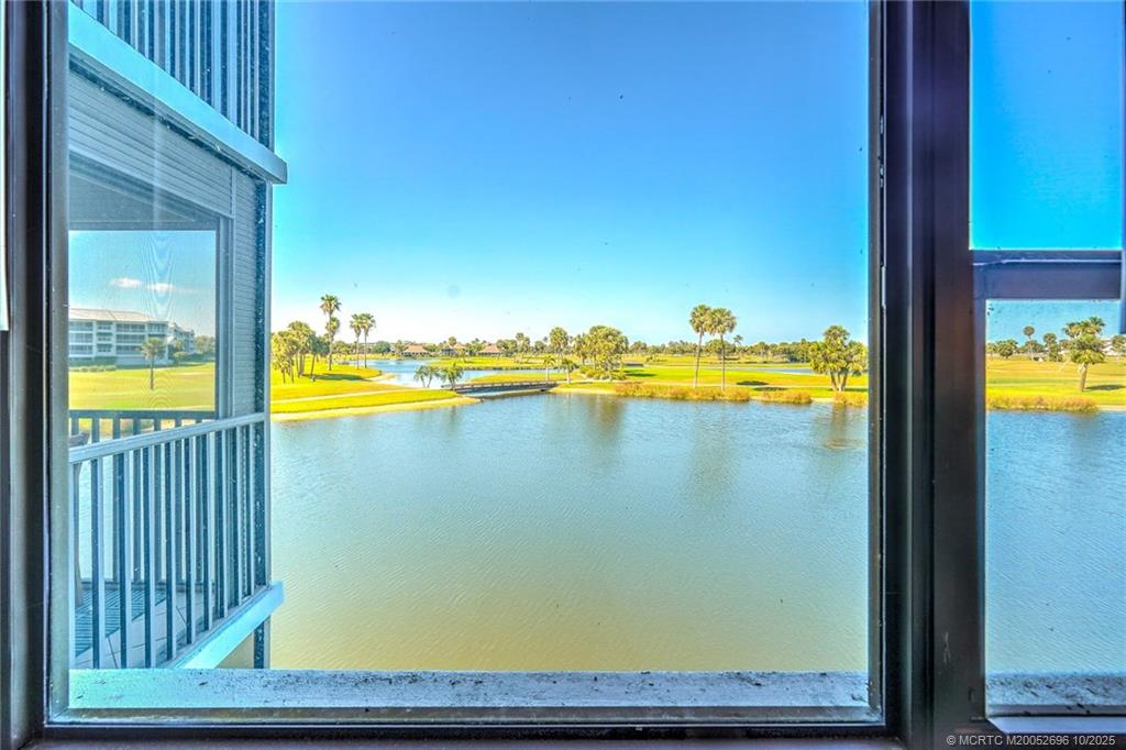 40 Northeast Plantation Road, Unit 203 Jensen Beach, FL 34957 - Photo 6 of 53 a view of a swimming pool with an outdoor space and seating area