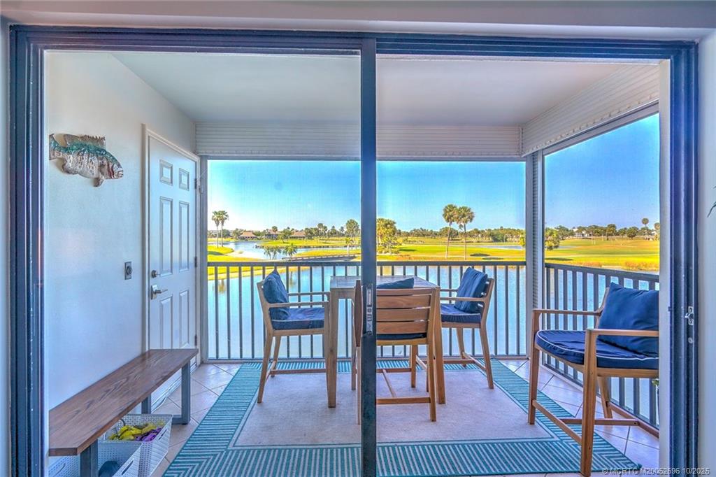 40 Northeast Plantation Road, Unit 203 Jensen Beach, FL 34957 - Photo 8 of 53 a view of a dining room with furniture and a window