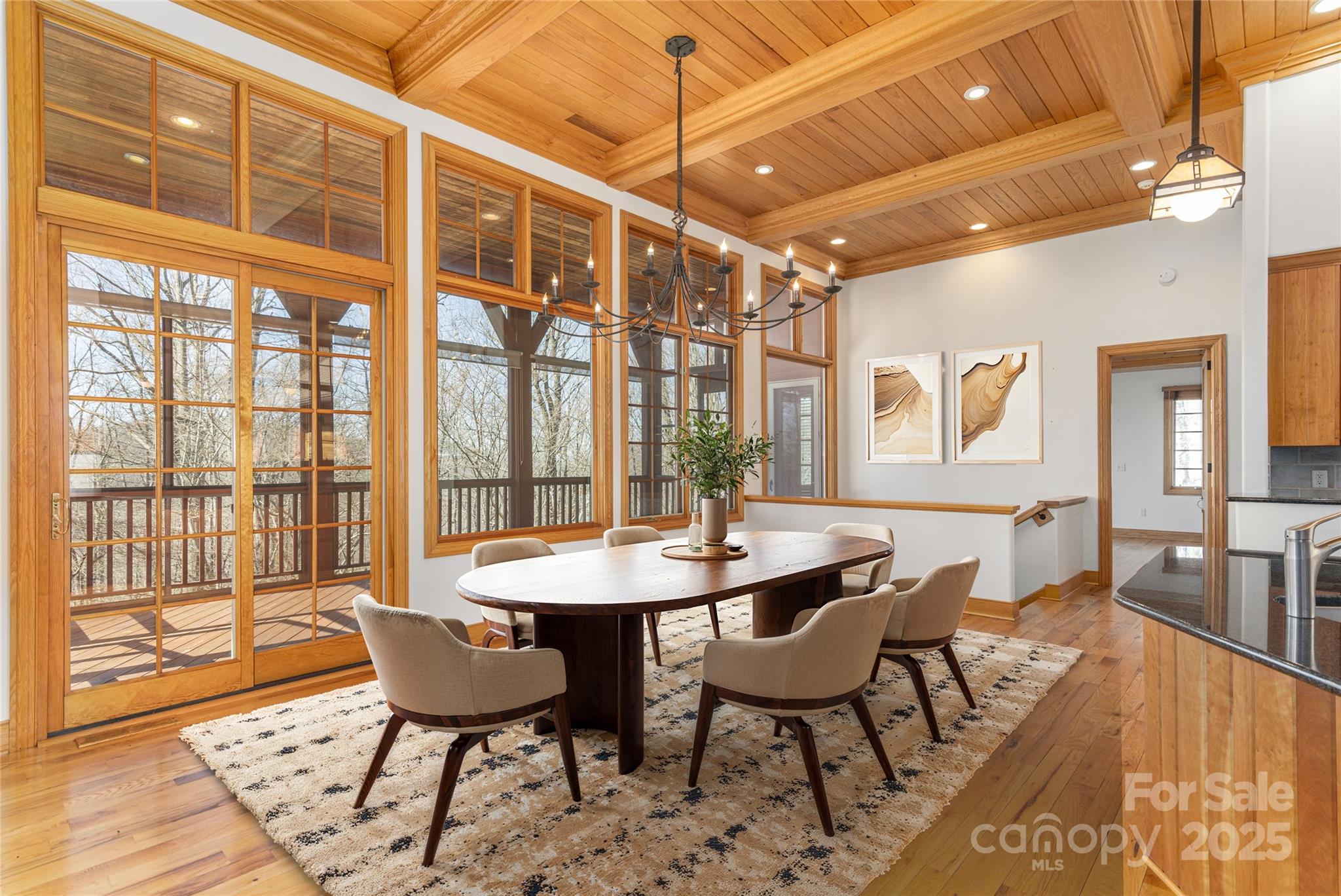 98 Flat Creek Road Fairview, NC 28730 - Photo 11 of 47 a dining room with furniture a chandelier and wooden floor