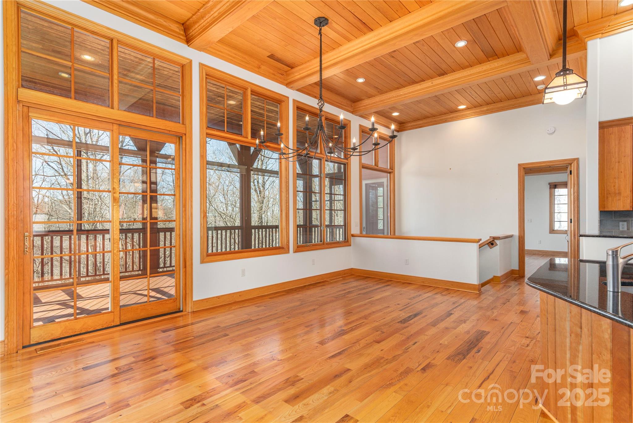 98 Flat Creek Road Fairview, NC 28730 - Photo 12 of 47 a view of an empty room with wooden floor and a window