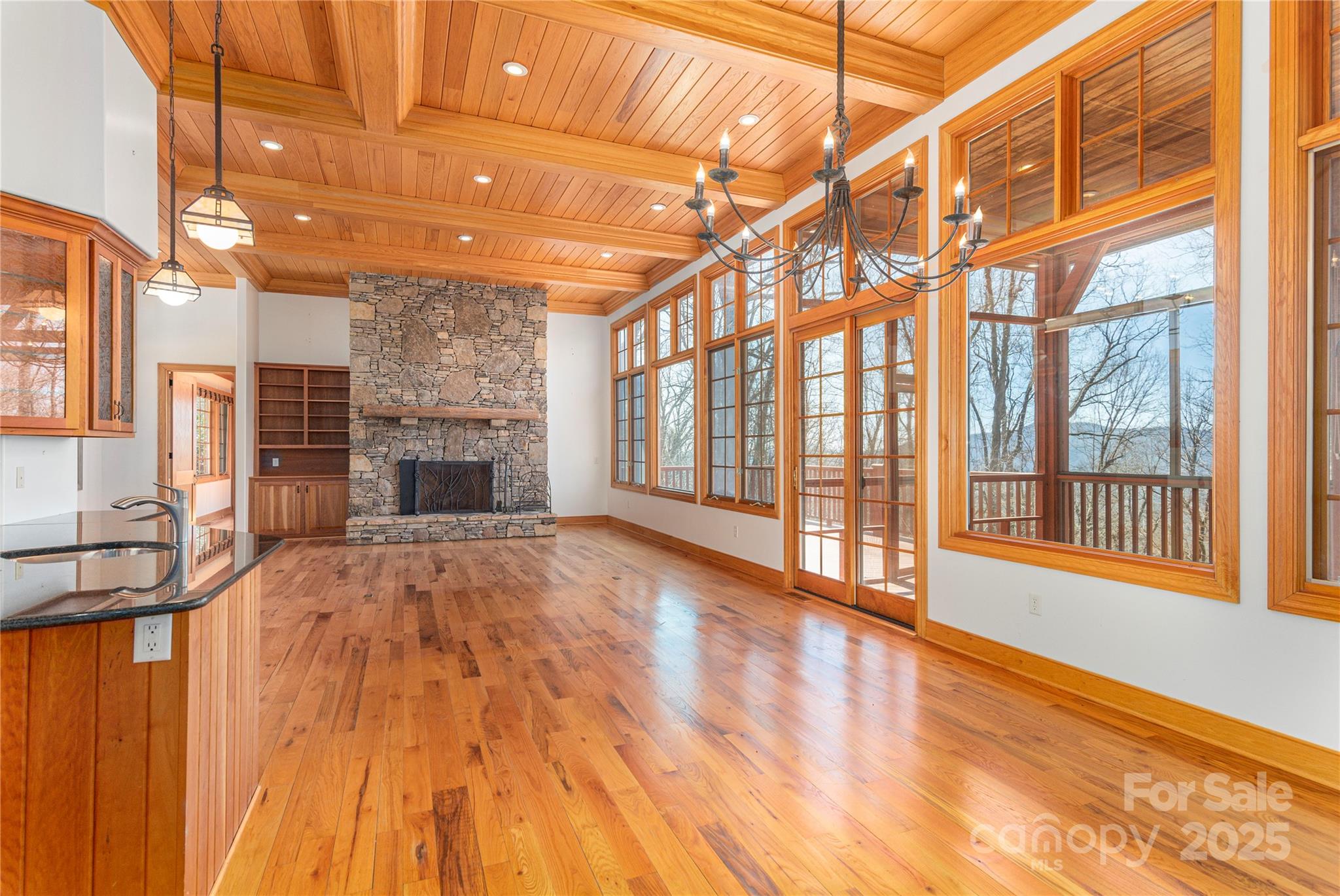 98 Flat Creek Road Fairview, NC 28730 - Photo 16 of 47 a view of an empty room with a fireplace and a window