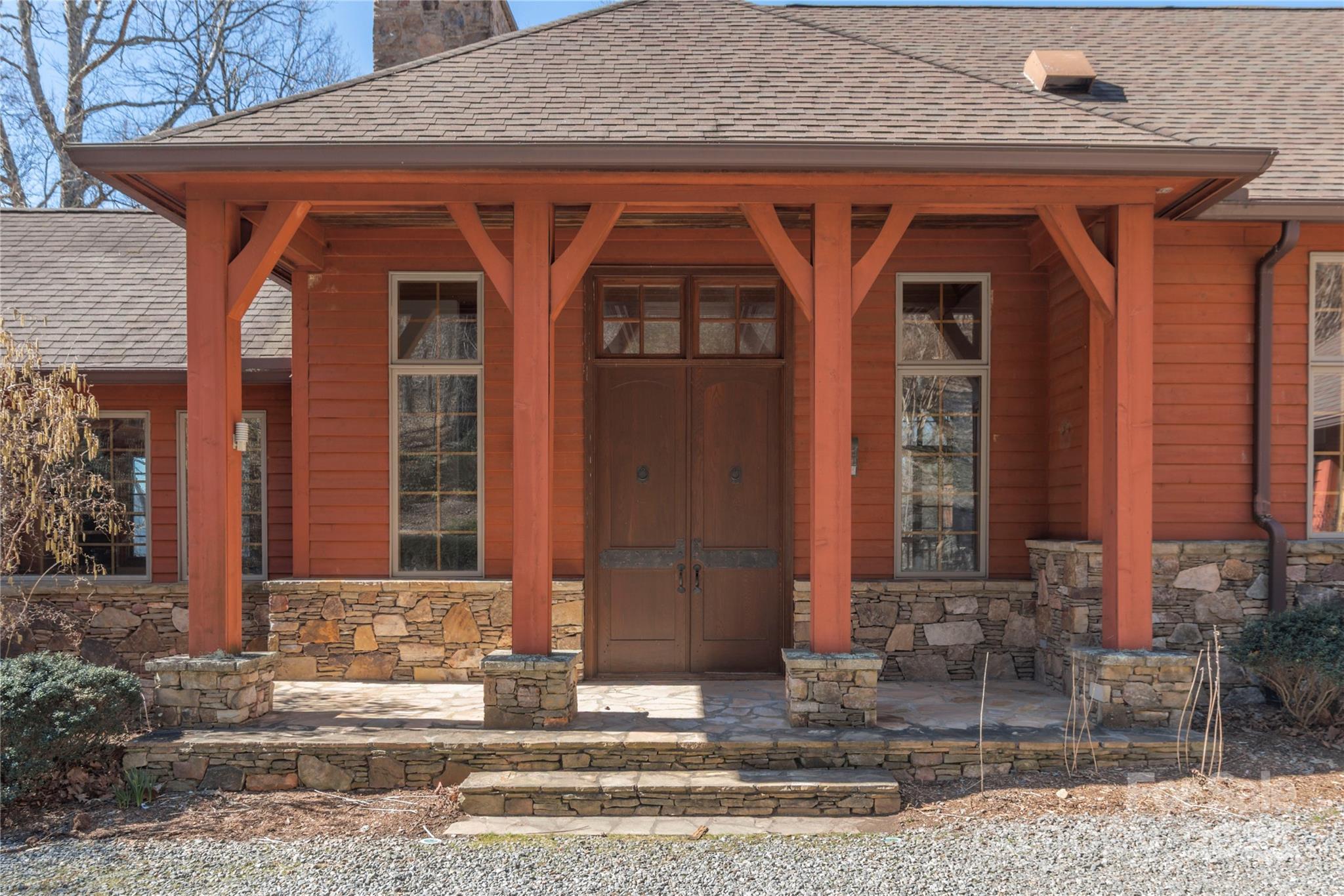98 Flat Creek Road Fairview, NC 28730 - Photo 2 of 47 a front view of a house with garden