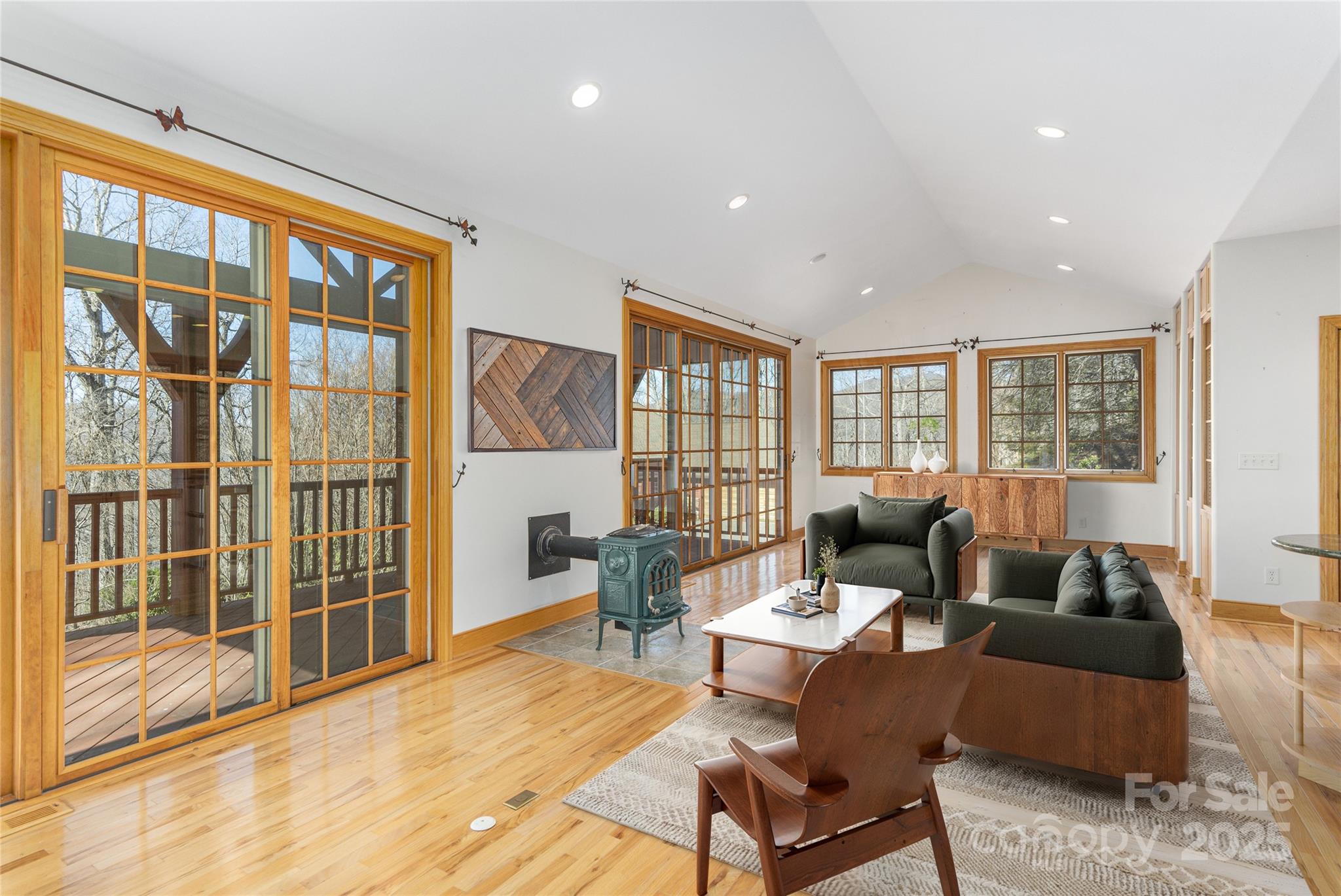 98 Flat Creek Road Fairview, NC 28730 - Photo 33 of 47 a living room with furniture and floor to ceiling windows