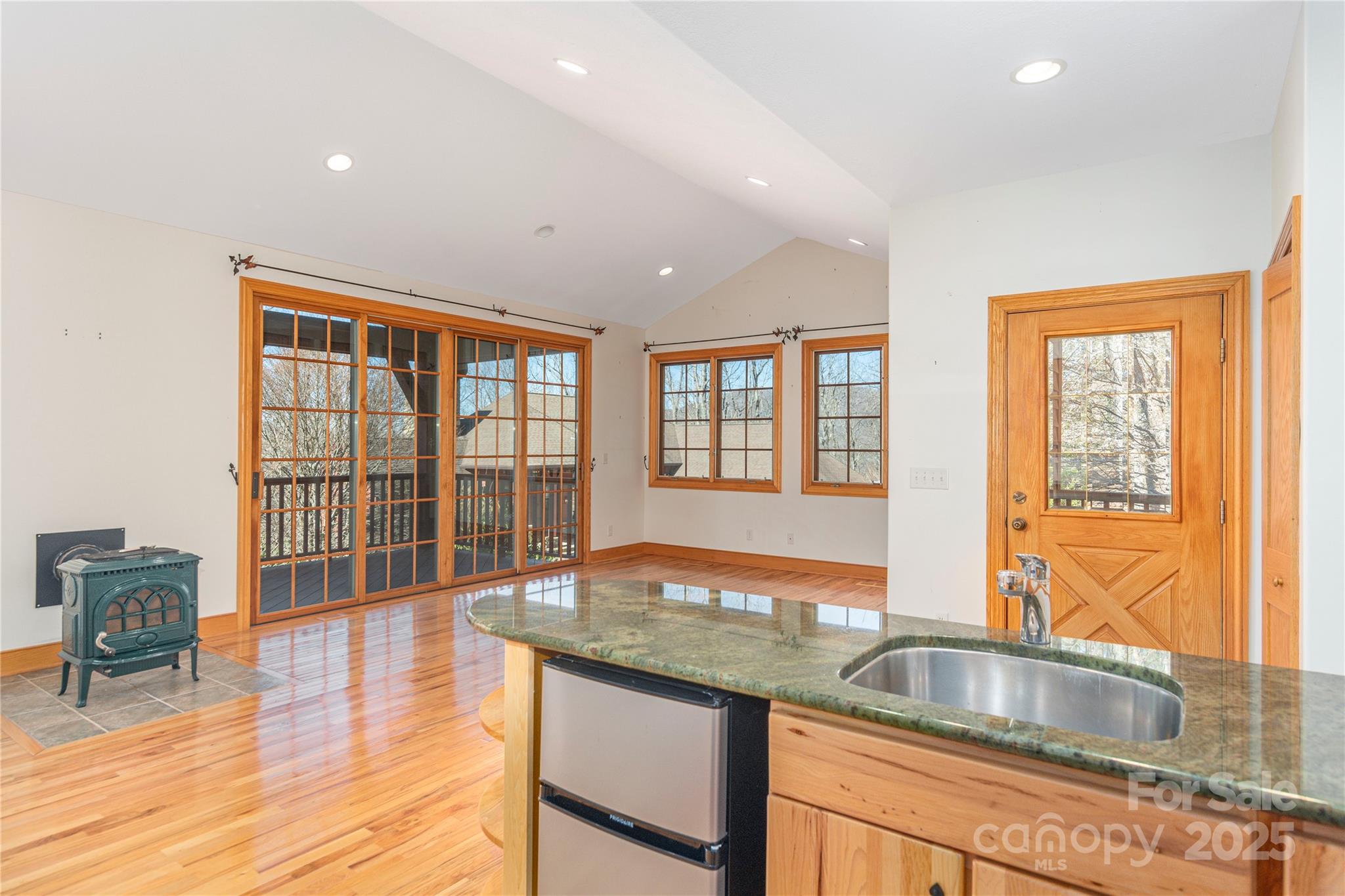98 Flat Creek Road Fairview, NC 28730 - Photo 34 of 47 a kitchen with granite countertop a sink and a counter top space