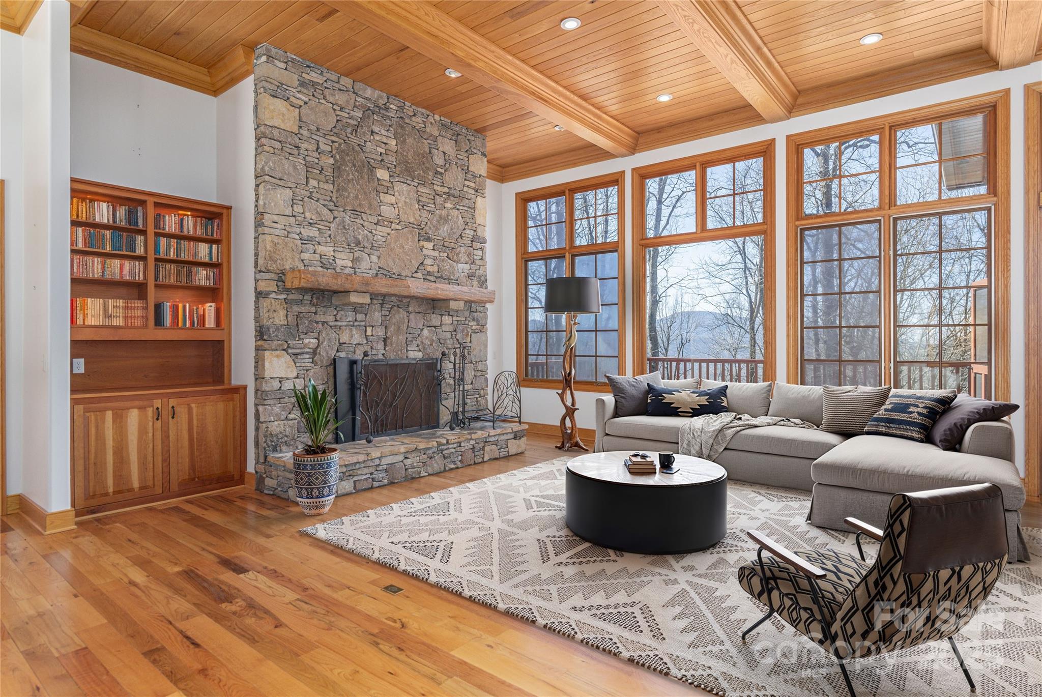 98 Flat Creek Road Fairview, NC 28730 - Photo 7 of 47 a living room with furniture and a fireplace