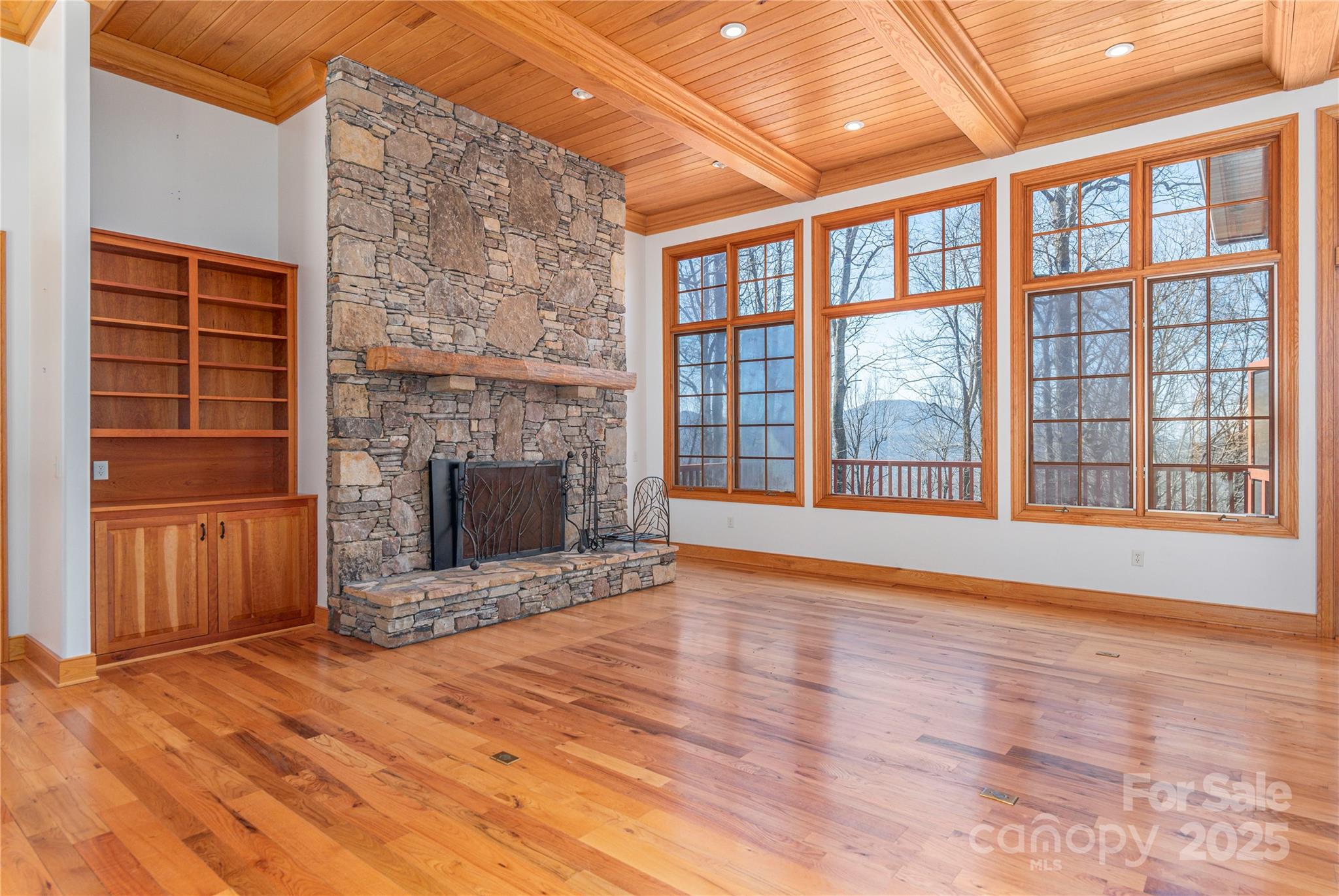 98 Flat Creek Road Fairview, NC 28730 - Photo 8 of 47 a view of an empty room with glass door and wooden floor