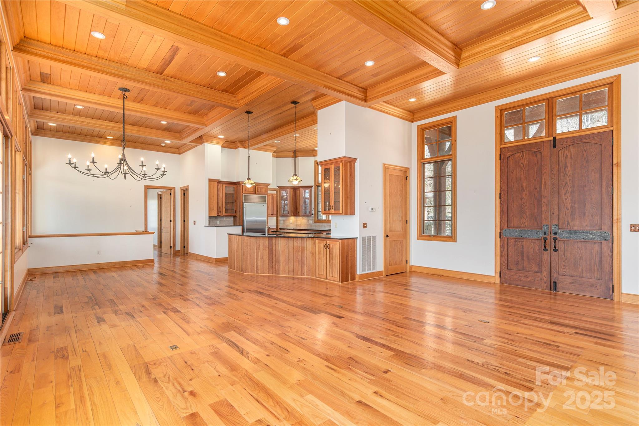 98 Flat Creek Road Fairview, NC 28730 - Photo 10 of 47 a view of empty room with wooden floor and windows