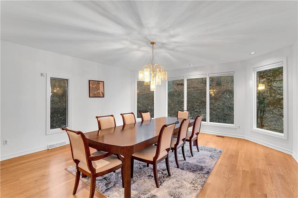 413 Windmere Drive Pittsburgh, PA 15238 - Photo 16 of 50 a dining room with furniture large windows and a chandelier