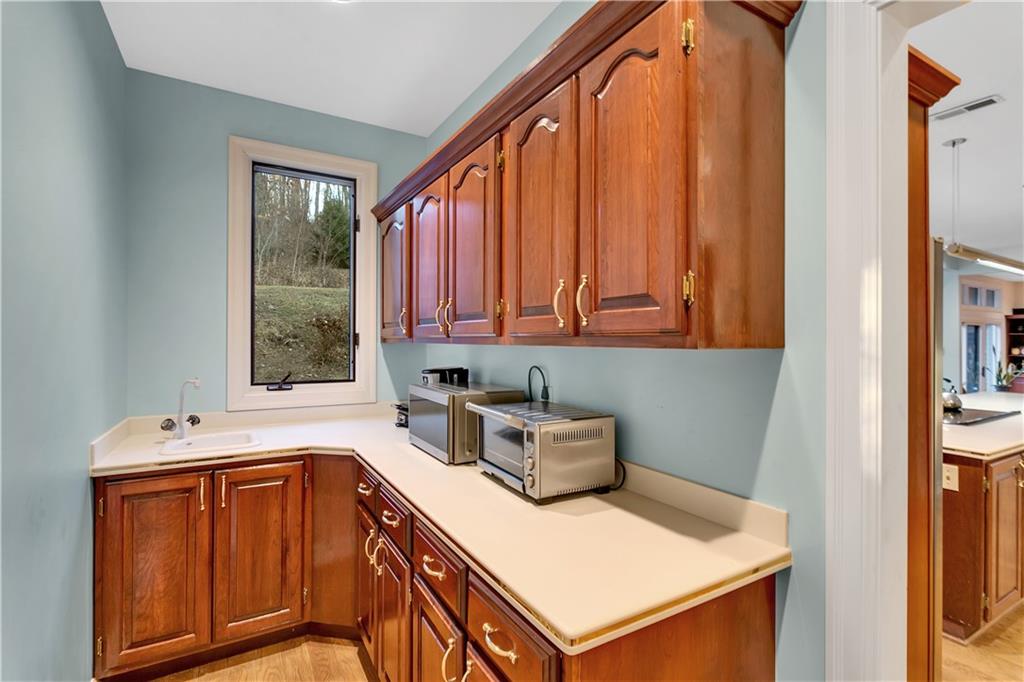 413 Windmere Drive Pittsburgh, PA 15238 - Photo 17 of 50 a kitchen that has a sink a stove and a window