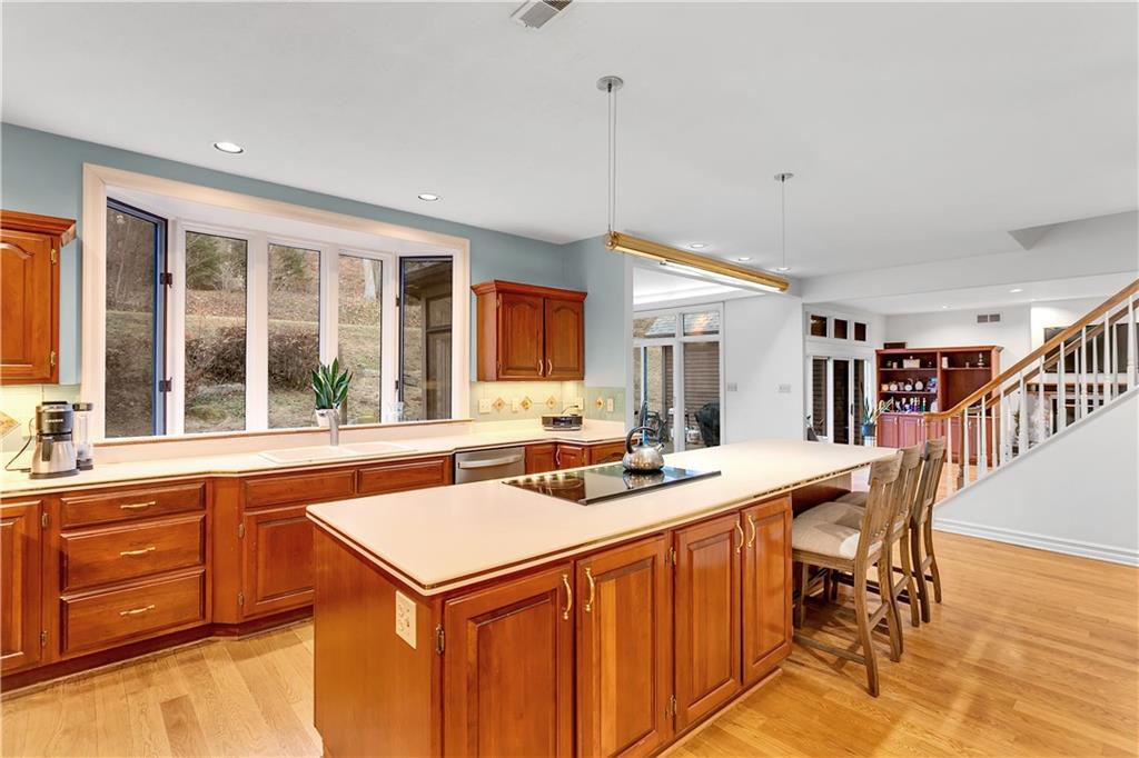 413 Windmere Drive Pittsburgh, PA 15238 - Photo 18 of 50 a kitchen that has a sink a stove and chairs