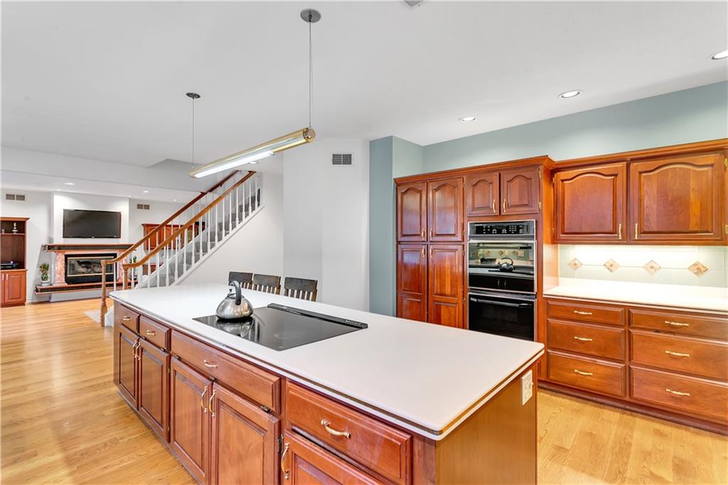413 Windmere Drive Pittsburgh, PA 15238 - Photo 19 of 50 a kitchen with stainless steel appliances granite countertop a sink a stove and a refrigerator