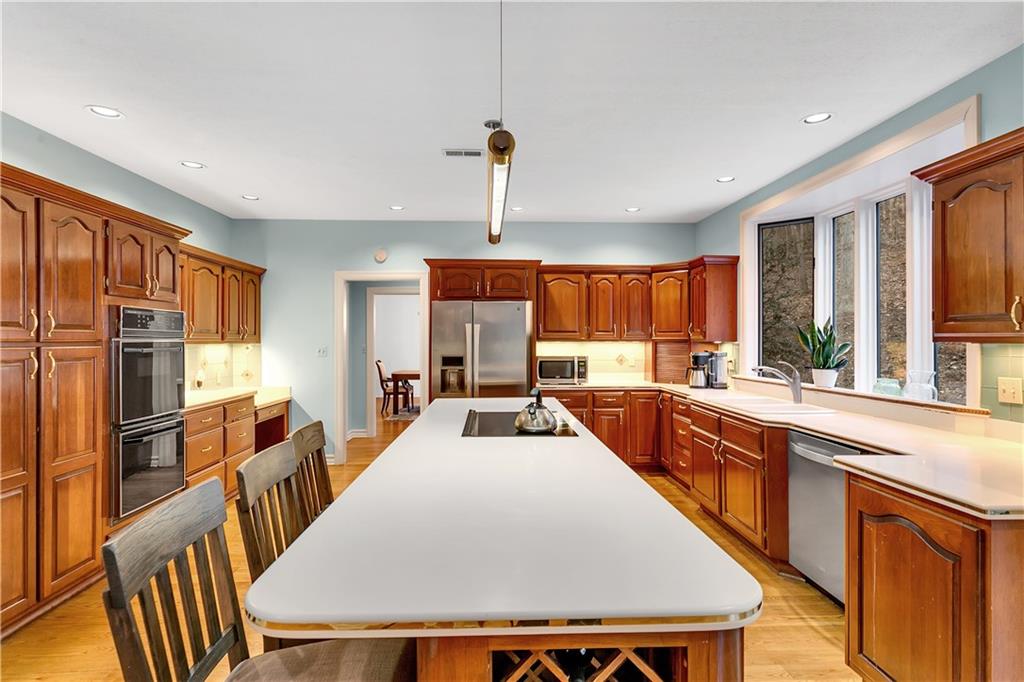413 Windmere Drive Pittsburgh, PA 15238 - Photo 20 of 50 a large kitchen with lots of counter space and windows