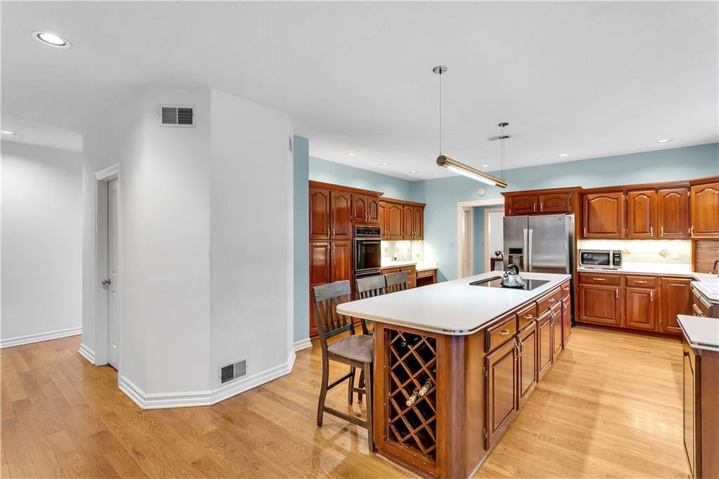 413 Windmere Drive Pittsburgh, PA 15238 - Photo 23 of 50 a kitchen with stainless steel appliances granite countertop a sink and a refrigerator