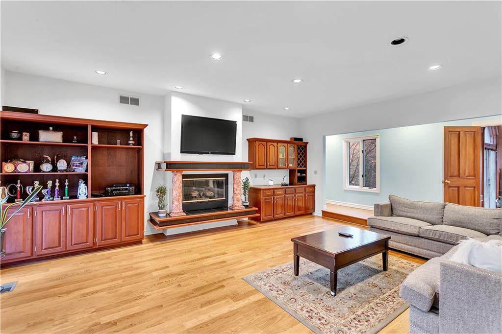 413 Windmere Drive Pittsburgh, PA 15238 - Photo 24 of 50 a living room with fireplace furniture and a flat screen tv