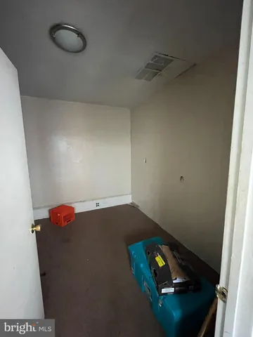 a room with gym equipment and a window