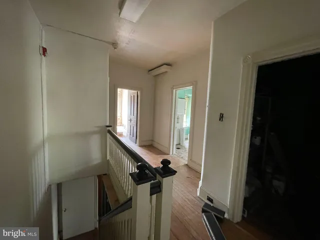 a view of a hallway with windows