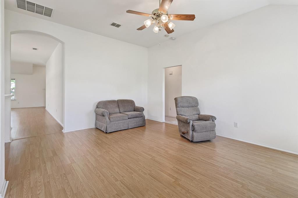 5424 Elk Ridge Drive Watauga, TX 76137 - Photo 14 of 40 a living room with furniture and a wooden floor