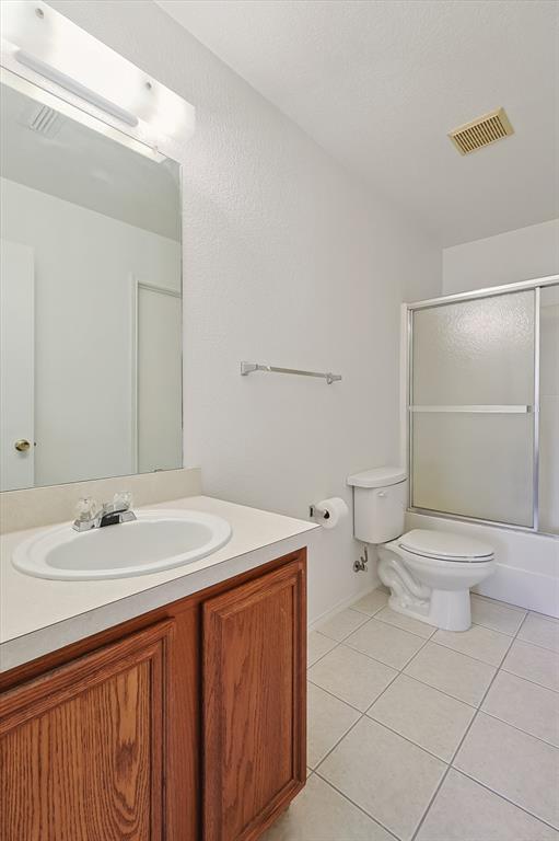 5424 Elk Ridge Drive Watauga, TX 76137 - Photo 22 of 40 a bathroom with a sink toilet and shower