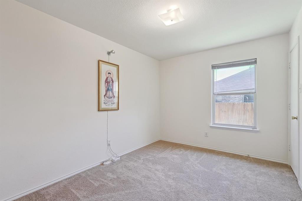 5424 Elk Ridge Drive Watauga, TX 76137 - Photo 25 of 40 an empty room with windows