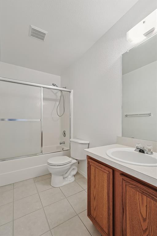 5424 Elk Ridge Drive Watauga, TX 76137 - Photo 28 of 40 a bathroom with a sink a toilet and shower