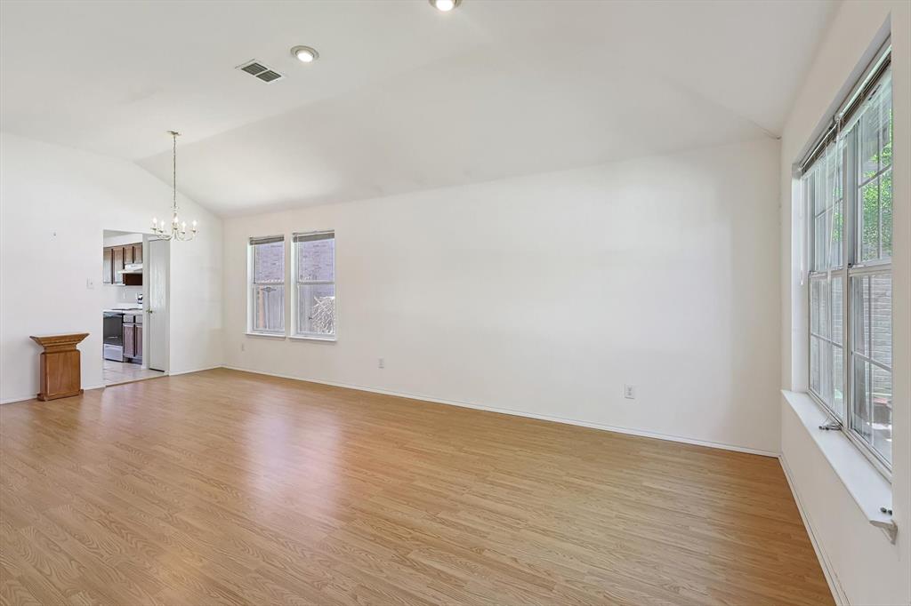 5424 Elk Ridge Drive Watauga, TX 76137 - Photo 3 of 40 a view of empty room with wooden floor and fan