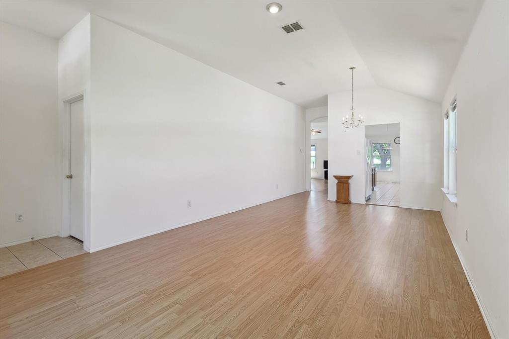 5424 Elk Ridge Drive Watauga, TX 76137 - Photo 5 of 40 a view of an empty room with wooden floor and a window