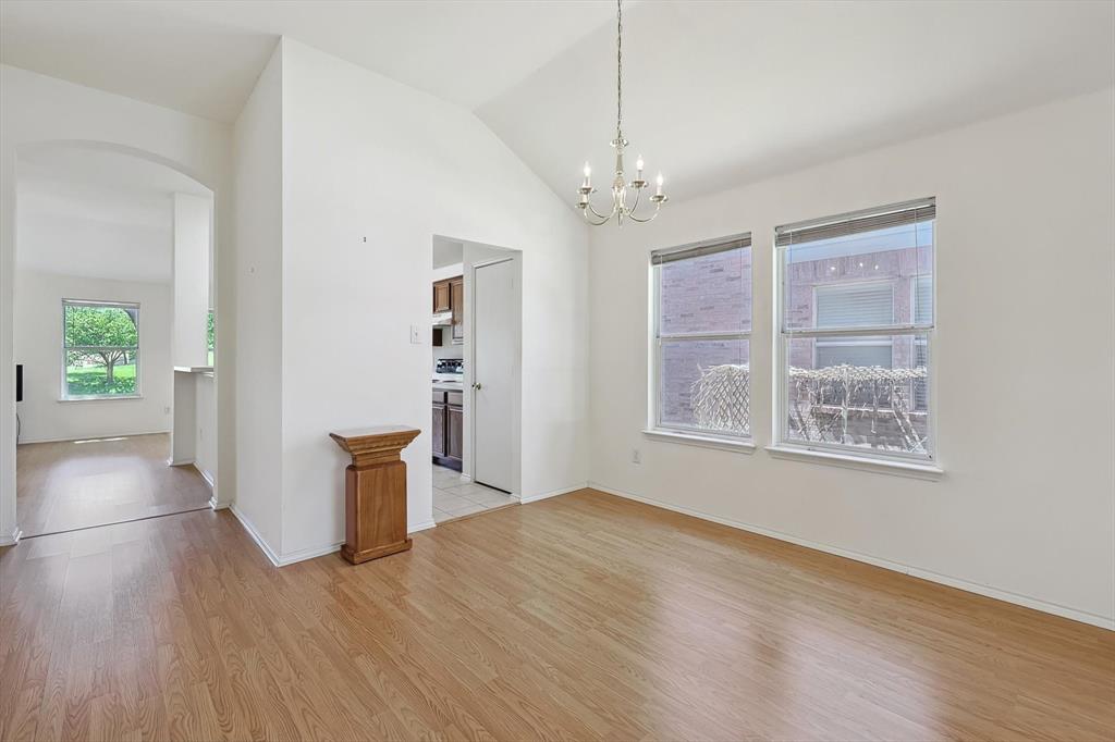 5424 Elk Ridge Drive Watauga, TX 76137 - Photo 6 of 40 a view of an empty room with wooden floor and a window