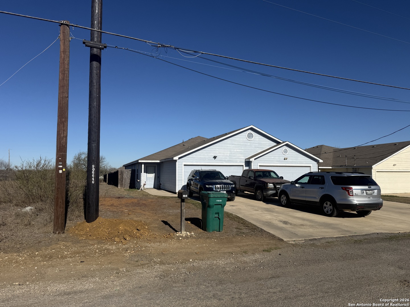 a view of a car park in front of house
