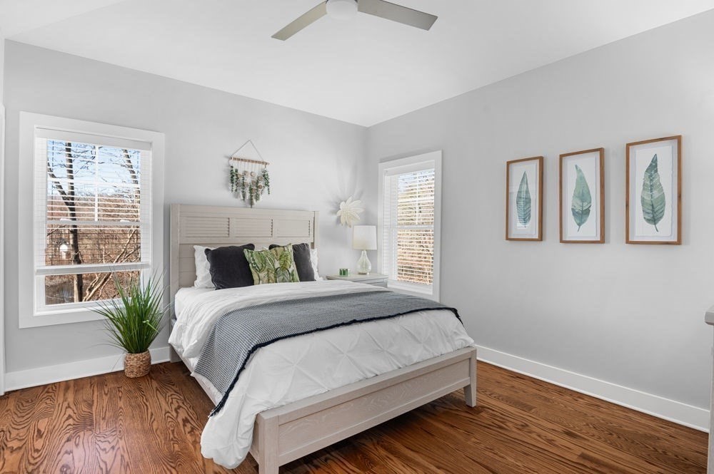 21 Hines Way, Unit 21 Newburyport, MA 01950 - Photo 14 of 21 a bedroom with a large bed wooden floor and window