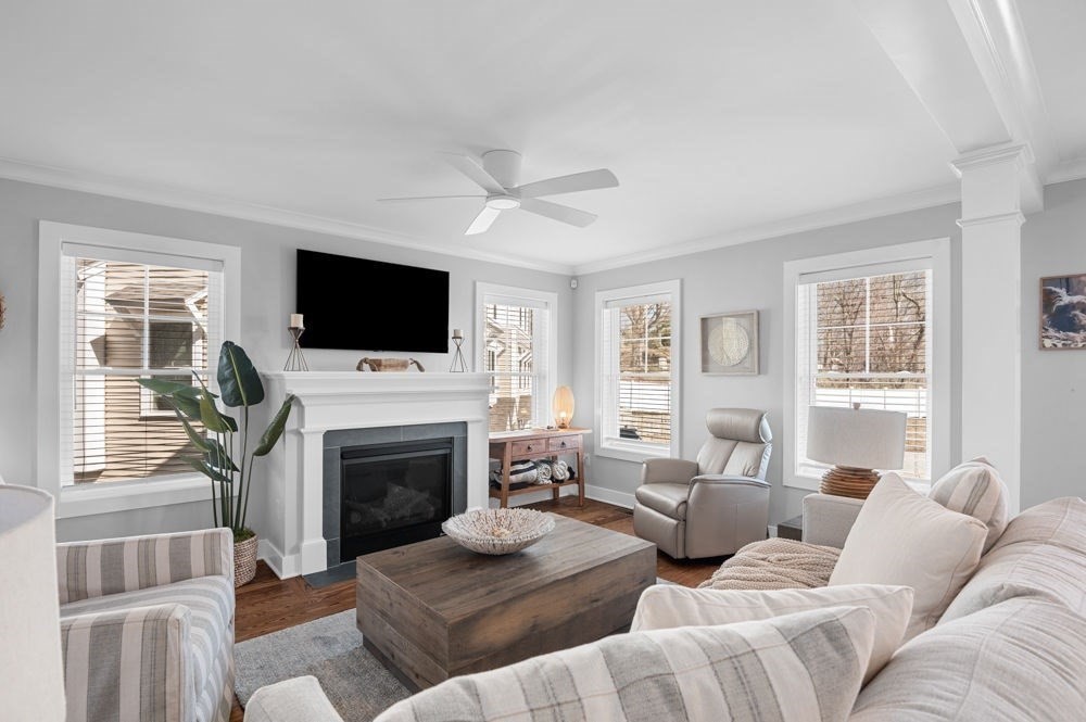 21 Hines Way, Unit 21 Newburyport, MA 01950 - Photo 8 of 21 a living room with furniture a fireplace and a flat screen tv