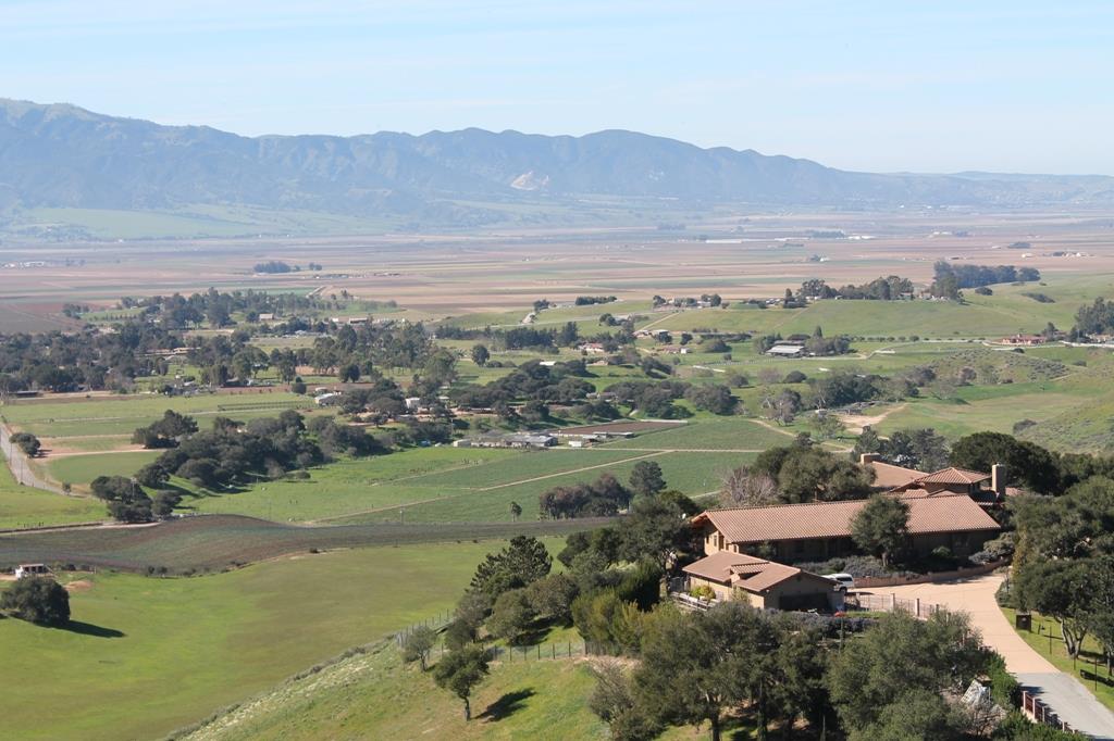 30100 Chualar Canyon Road Chualar, CA 93925 - Photo 1 of 20 an aerial view of lake with residential houses with outdoor space and trees