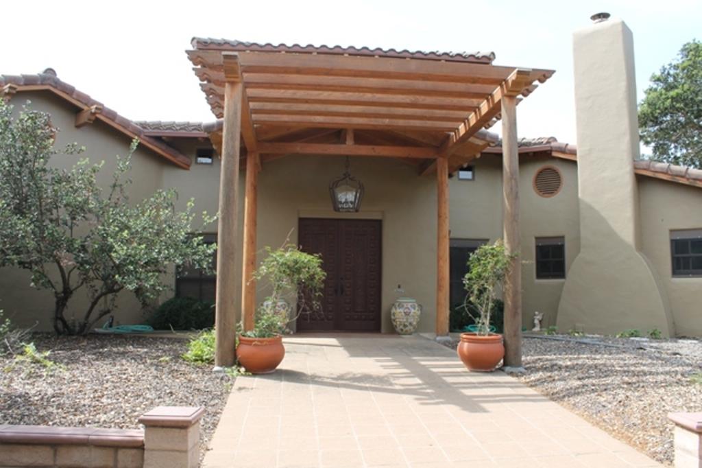 30100 Chualar Canyon Road Chualar, CA 93925 - Photo 4 of 20 a view of a house with potted plants and seating space
