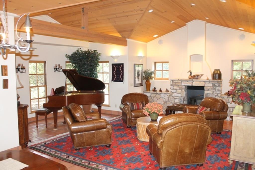 30100 Chualar Canyon Road Chualar, CA 93925 - Photo 7 of 20 a living room with fireplace furniture and a potted plant