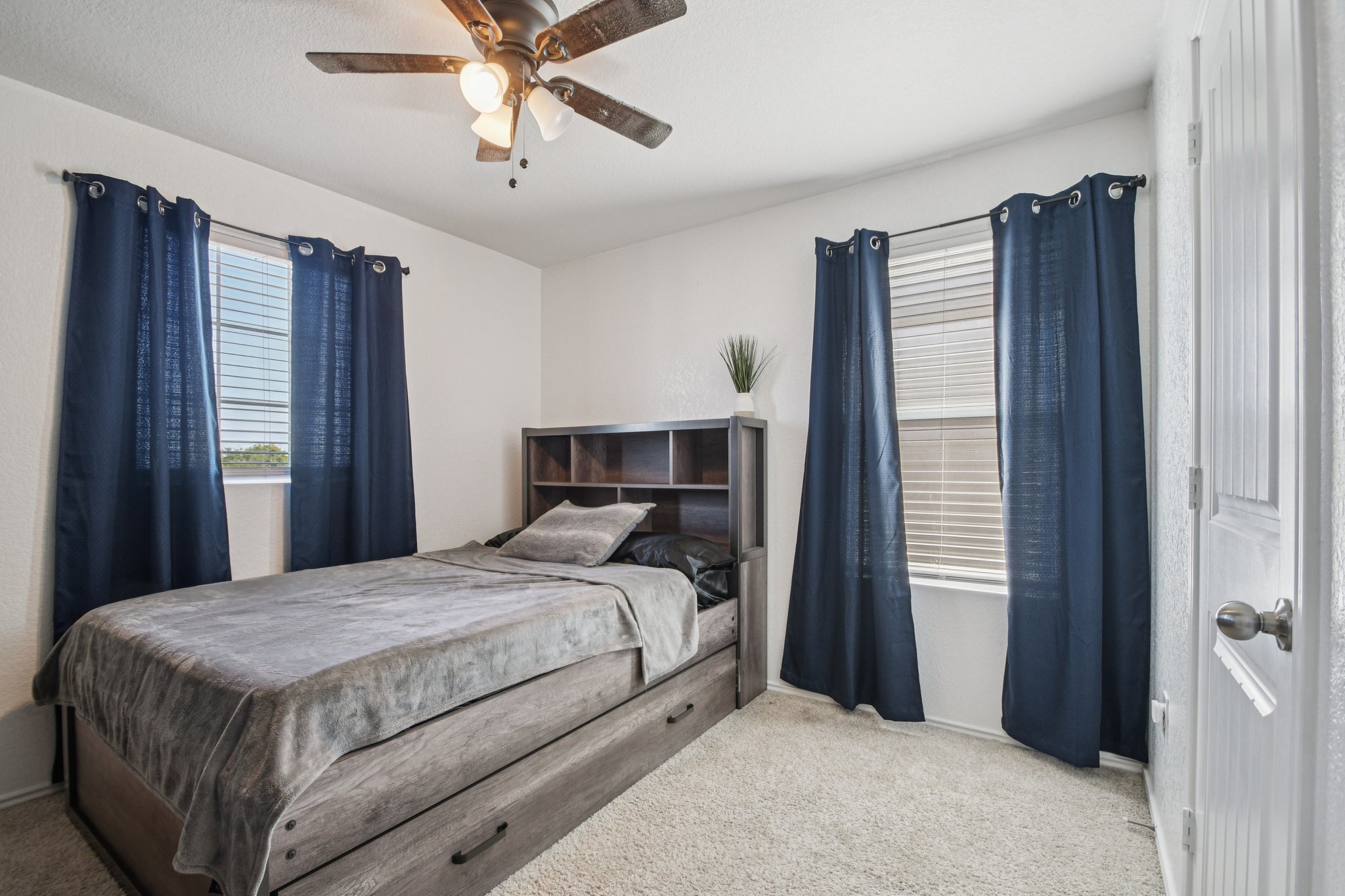 14904 Shalestone Way Manor, TX 78653 - Photo 13 of 23 Upstiars room #1 (accent wall on farside wall)