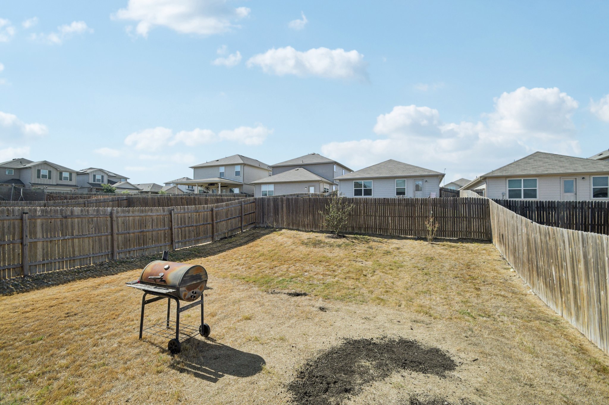 14904 Shalestone Way Manor, TX 78653 - Photo 23 of 23 Fenced backyard featuring a residential view