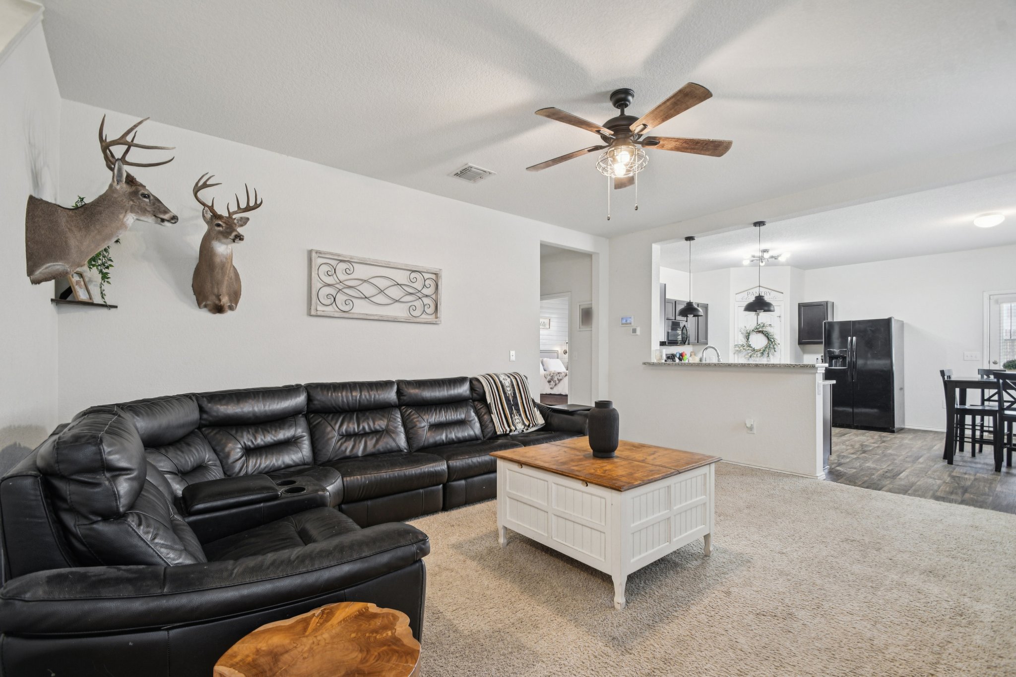 14904 Shalestone Way Manor, TX 78653 - Photo 5 of 23 Carpeted living room featuring ceiling fan