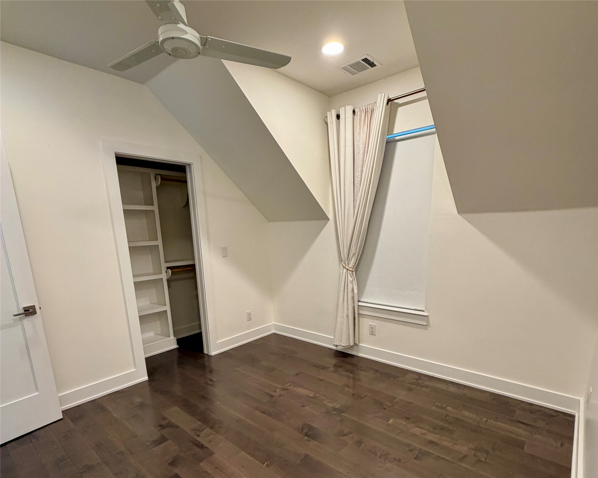 1515 Hether Street, Unit B Austin, TX 78704 - Photo 23 of 30 A tranquil bedroom with rich hardwood floors and an integrated closet awaits its next resident.