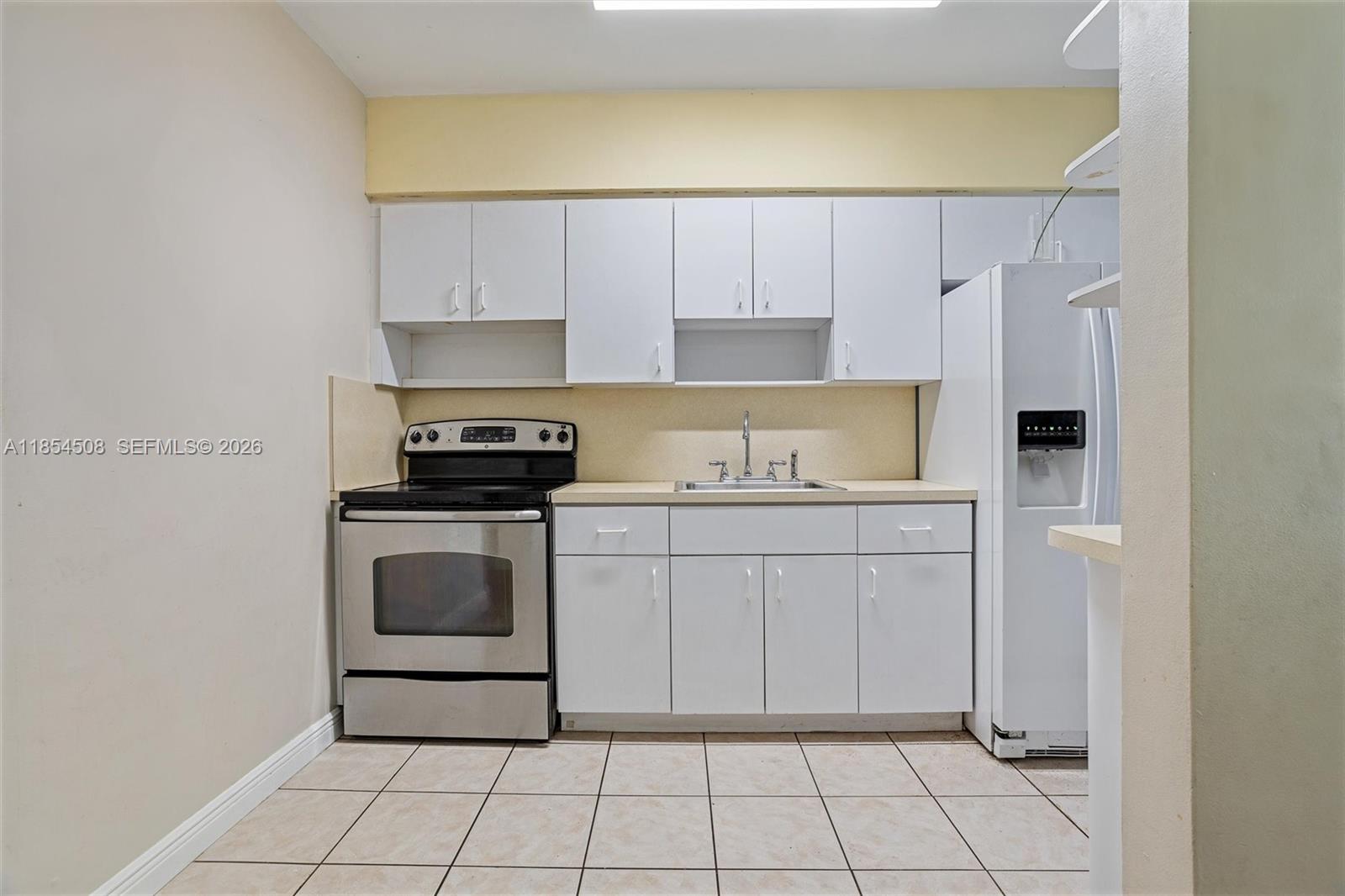 1701 Southwest 21st Street Miami, FL 33145 - Photo 15 of 28 a kitchen with a sink and a stove top oven
