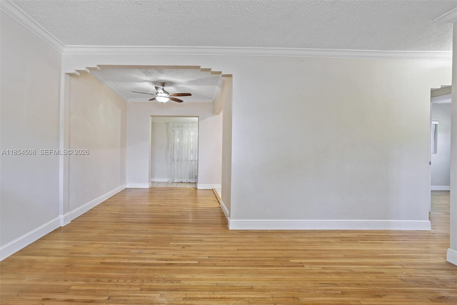 1701 Southwest 21st Street Miami, FL 33145 - Photo 17 of 28 a view of an empty room with wooden floor and a window