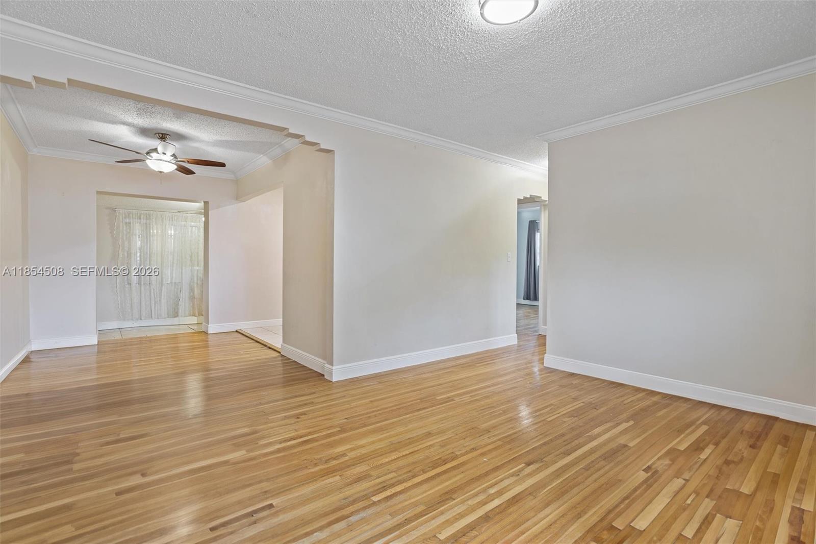 1701 Southwest 21st Street Miami, FL 33145 - Photo 18 of 28 wooden floor in an empty room with a window