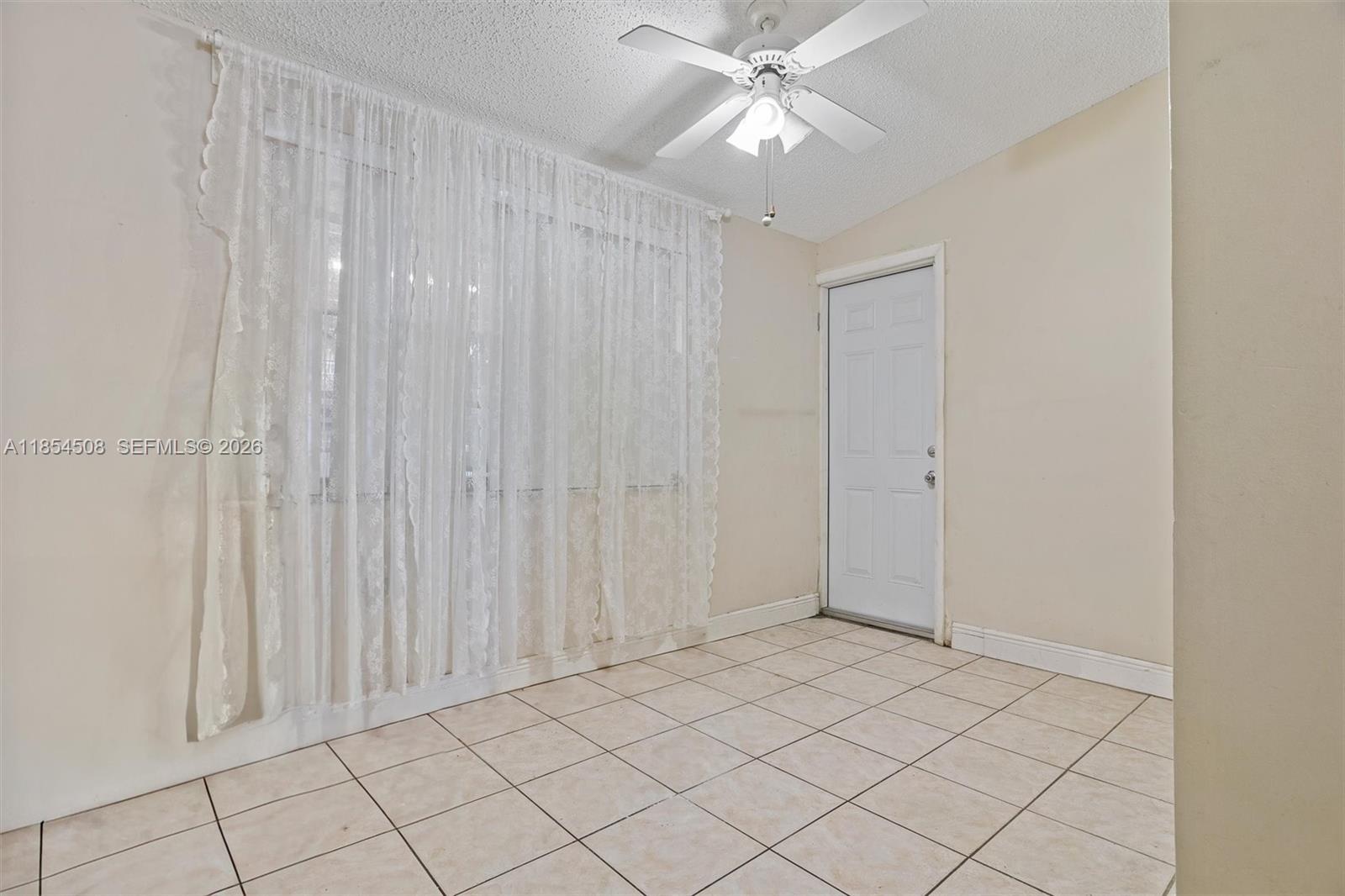 1701 Southwest 21st Street Miami, FL 33145 - Photo 20 of 28 a view of an empty room and chandelier fan